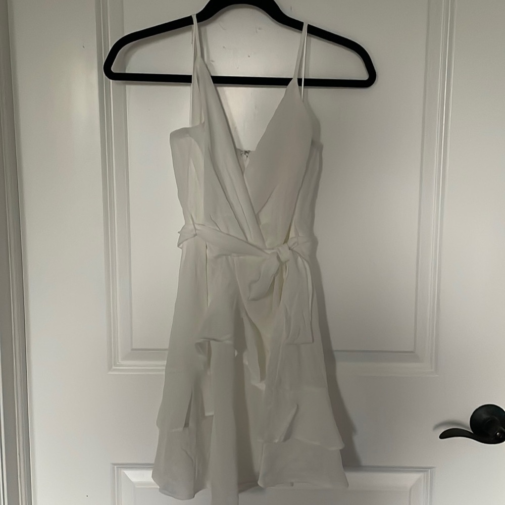 Francesca’s white wrap around dress